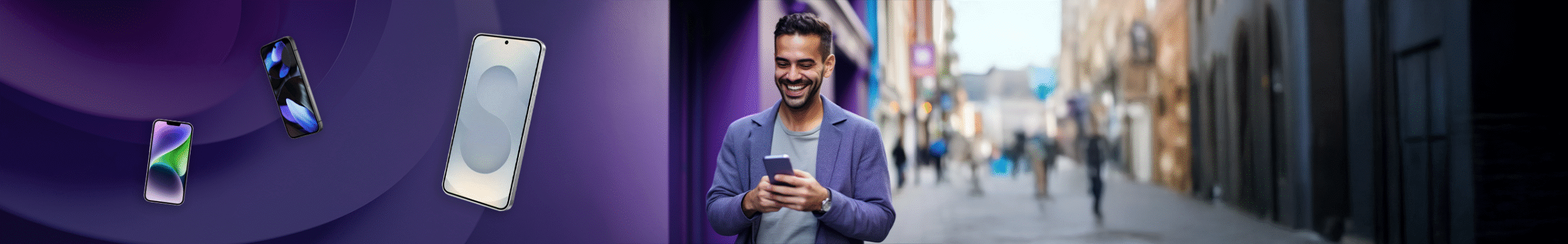 Man wearing purple holding a mobile phone whilst smiling