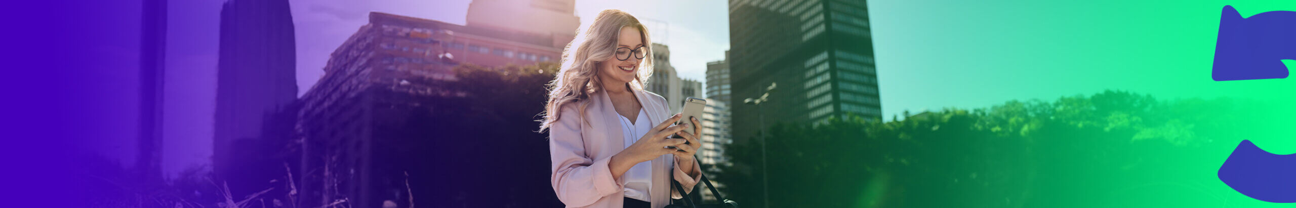 lady on her phone whilst walking through a city